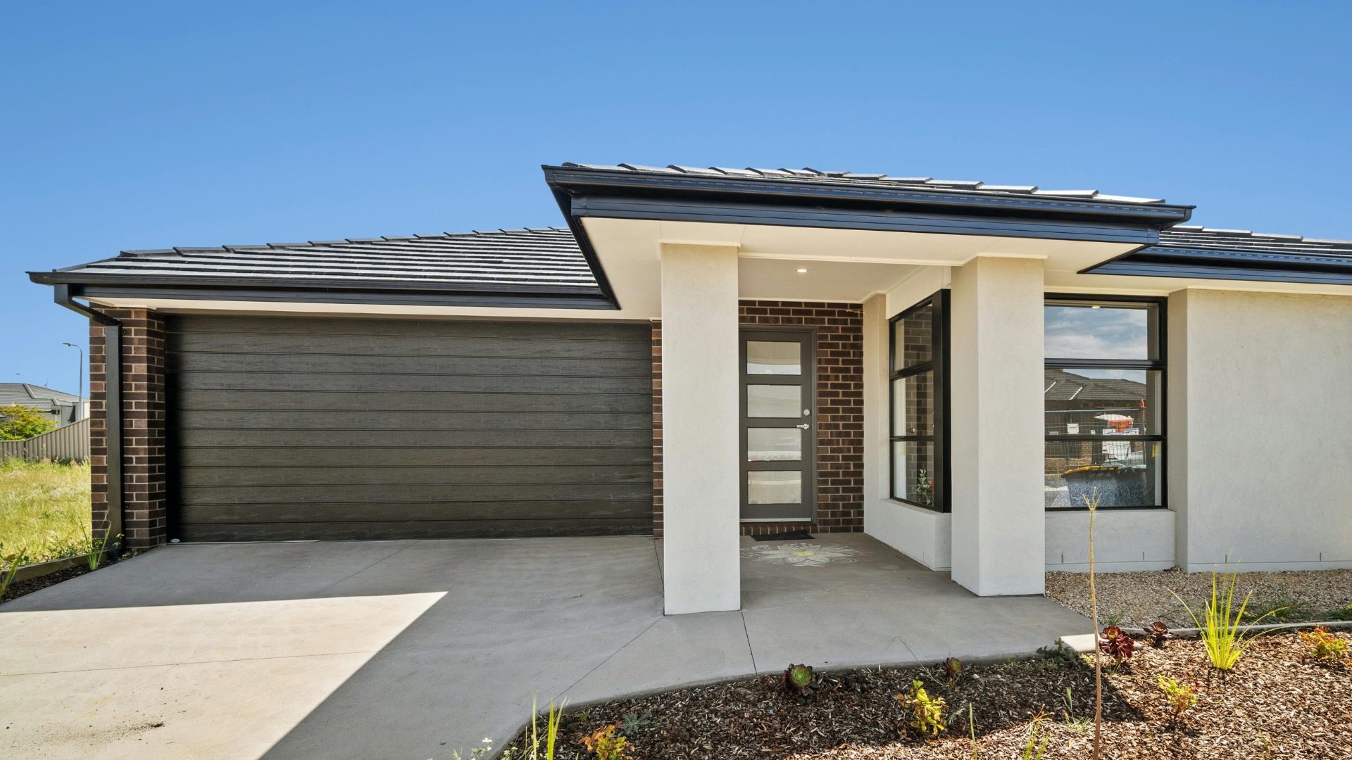 A professionally installed faux wood garage door that boosts curb appeal and home value.