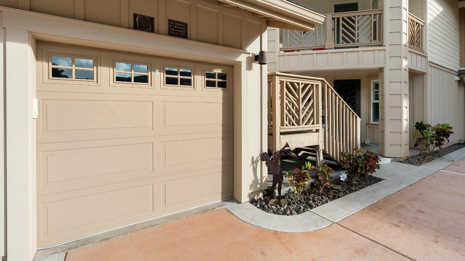 A newly installed garage door with faux windows