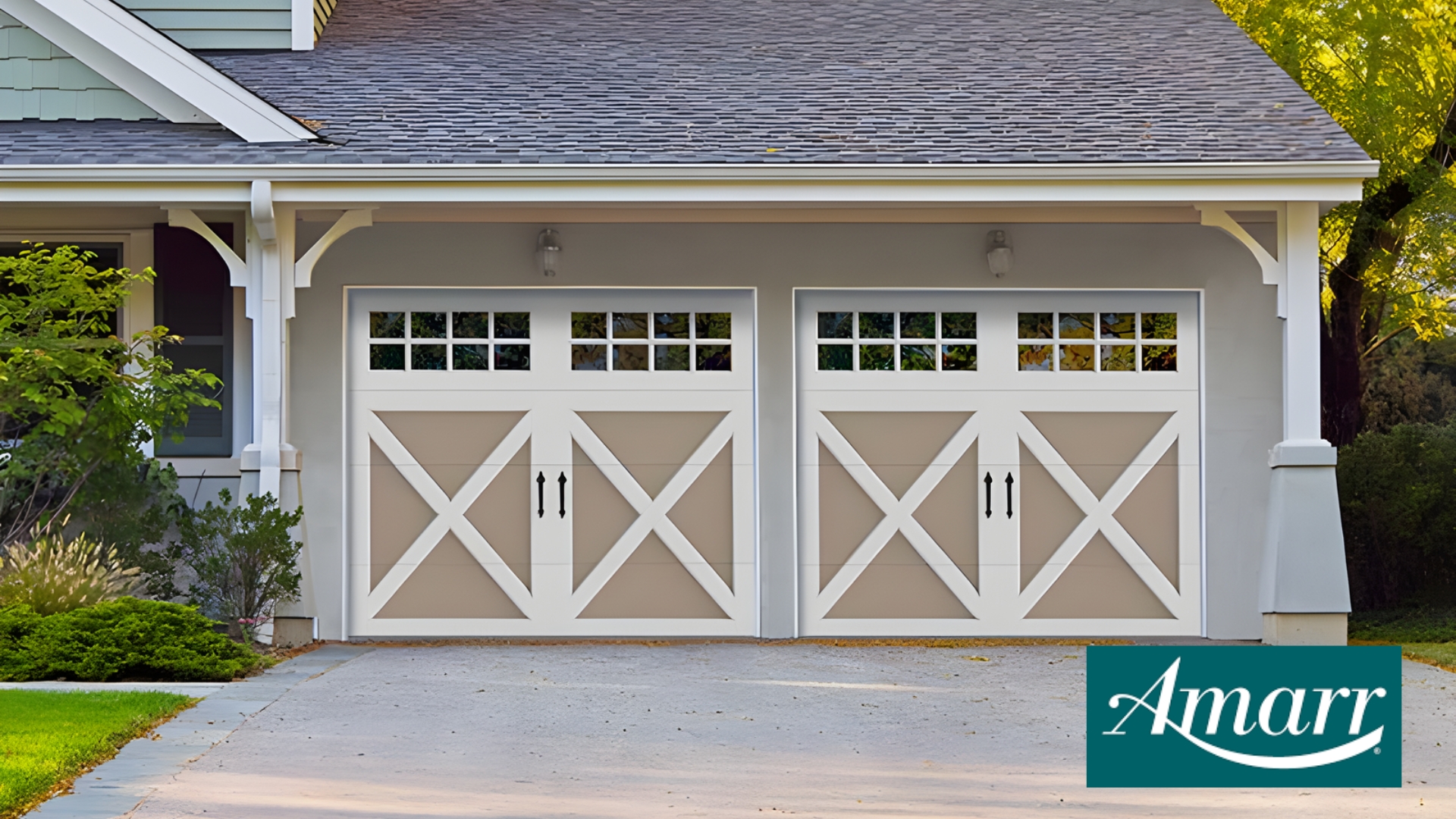Carriage-style doors with white trim and windows from Amarr, one of the best garage door brands for modern homes.